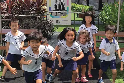 Children playing together in Pegasus International Preschool uniforms