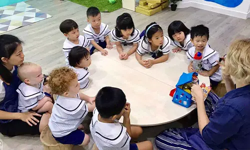 Children joining circle time classroom activity at Pegasus International Preschool Singapore